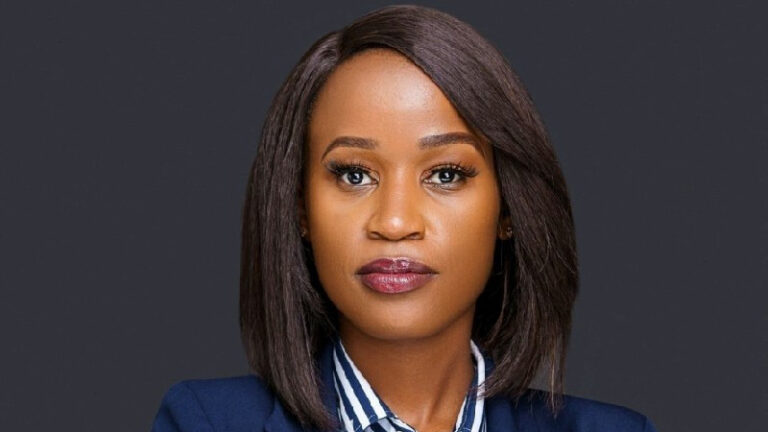 Jane Gaty, Head of Brand, Experience and Corporate Impact at AAR Healthcare, in a navy blazer and striped shirt