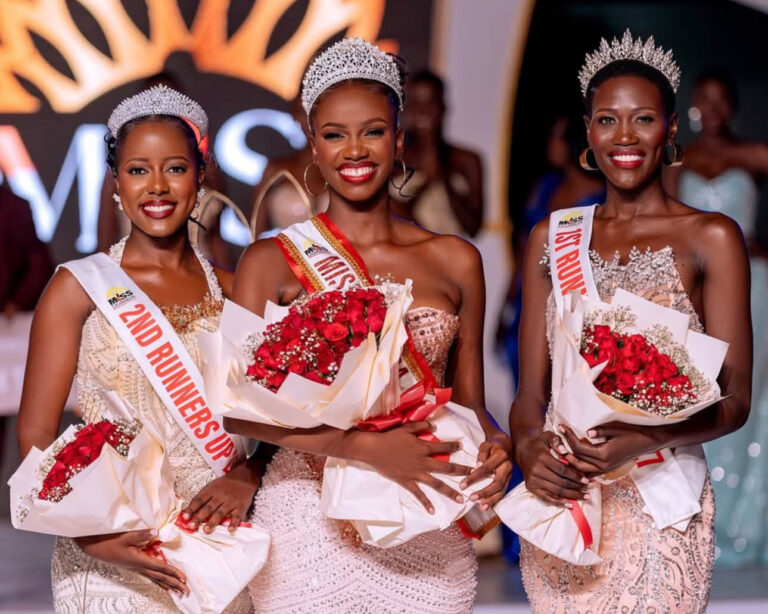 Miss Uganda 2026/27 Almorie Nagayi with first runner up Bridget Prudence Nakato and second runner up Lukia Balunywa, holding red roses.